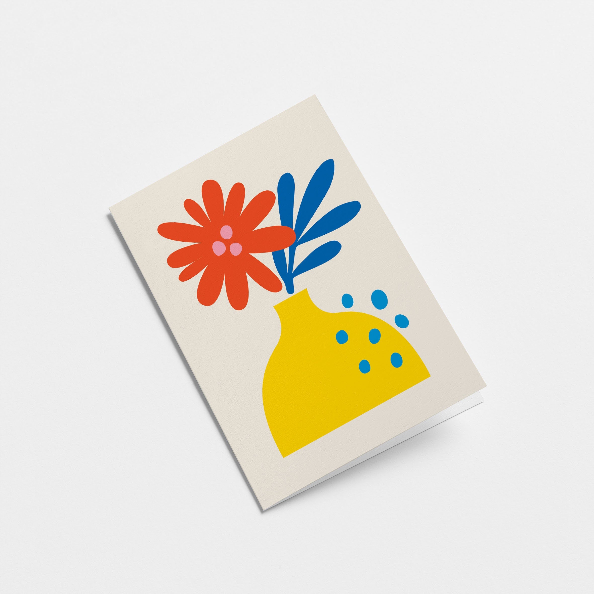 Greeting card with red and blue flowers and yellow vase
