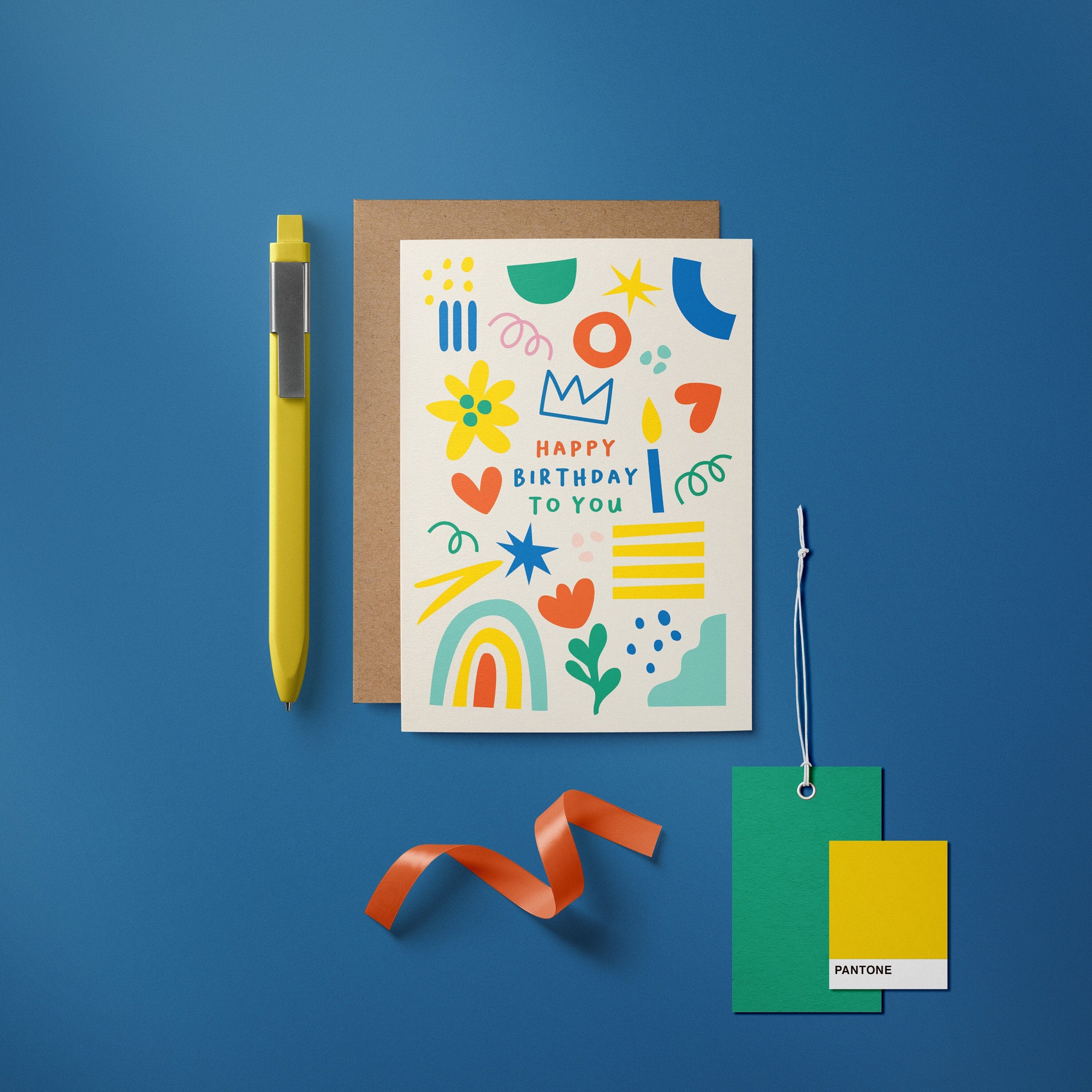 Birthday card with green, red, yellow, blue figures and a text that says happy birthday to you