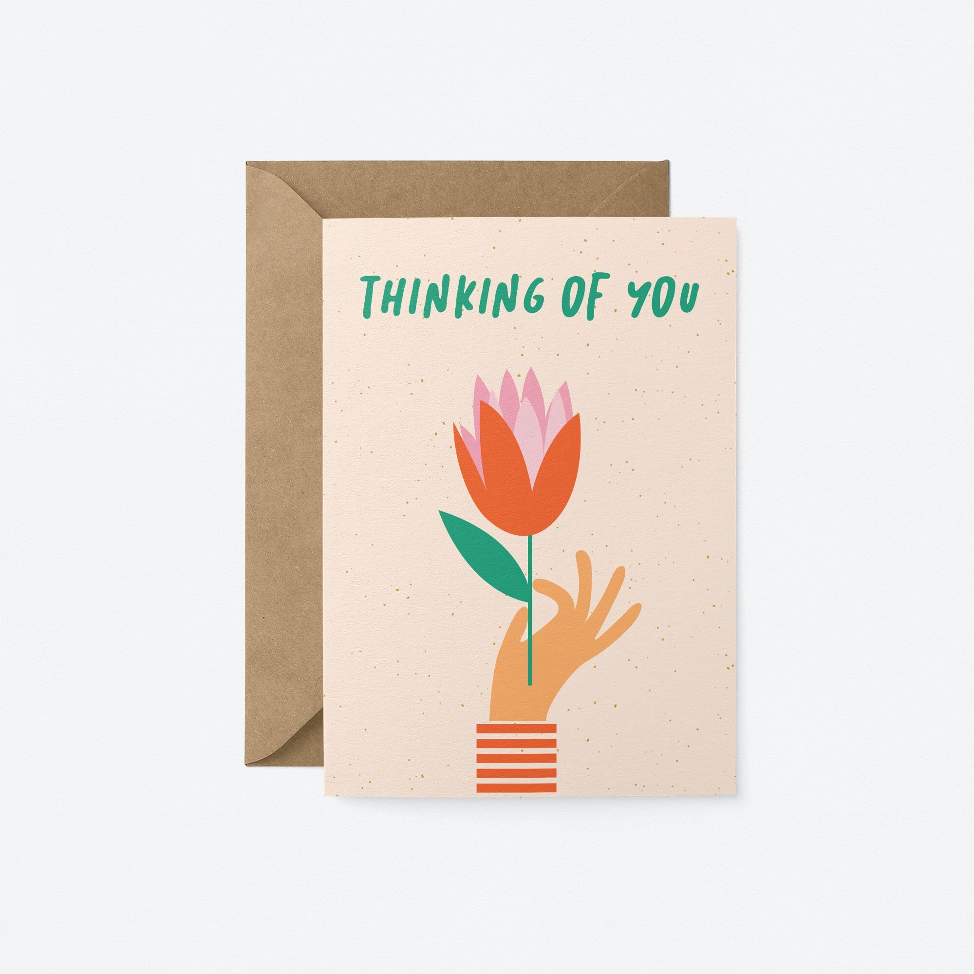 Thinking of you card with a hand holding red tulip and a text that says thinking of you