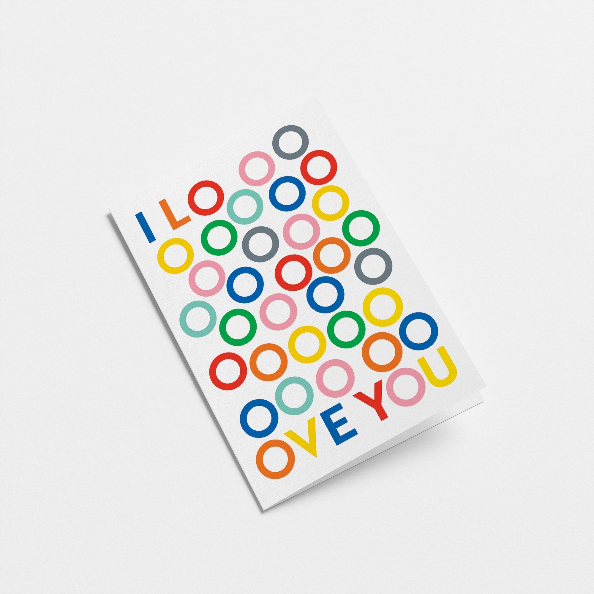 love card with colorful o letters and and a text of i love you