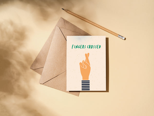 good luck card on an envelope and a pencil