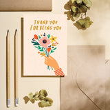 friendship card with a hand holding colorful flowers and a text that says thank you for being you