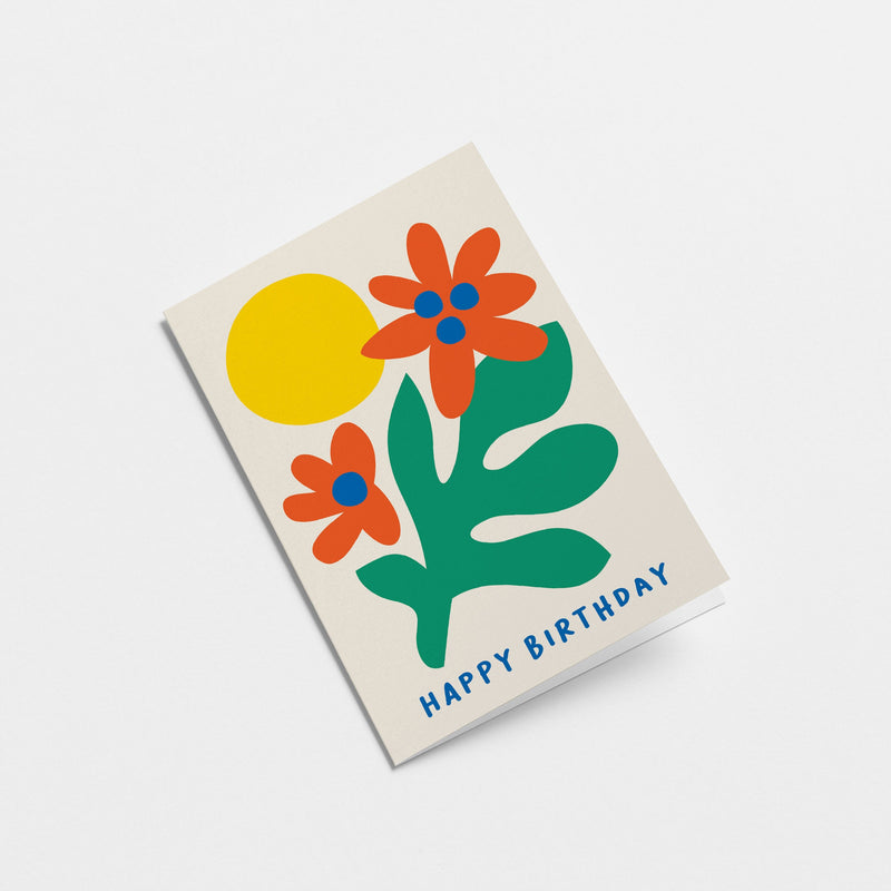 Birthday card with green plant, red and blue flowers and yellow sun with a text that says happy birthday