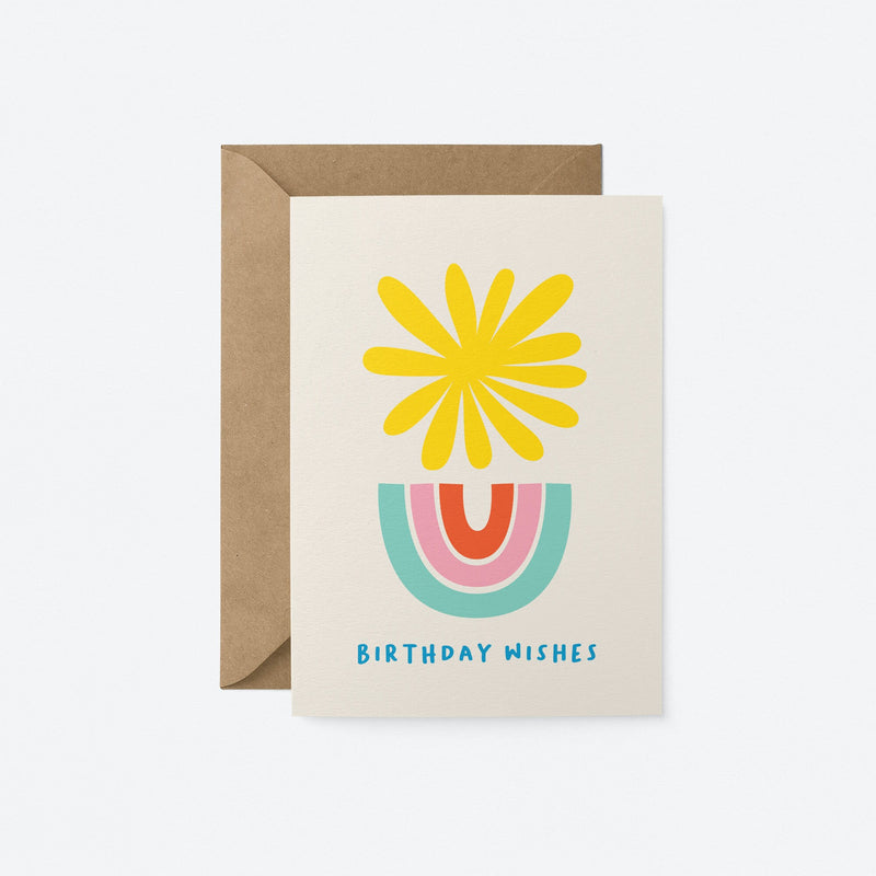Birthday card with a yellow sun and blue, pink, red rainbow and a text that says Birthday Wishes