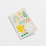 Sympathy card with rainbow, white flower, yellow plant, green, red and yellow figures with a text that says thinking of you