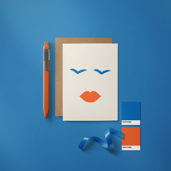 Love card with face shape, red lips, blue eyes