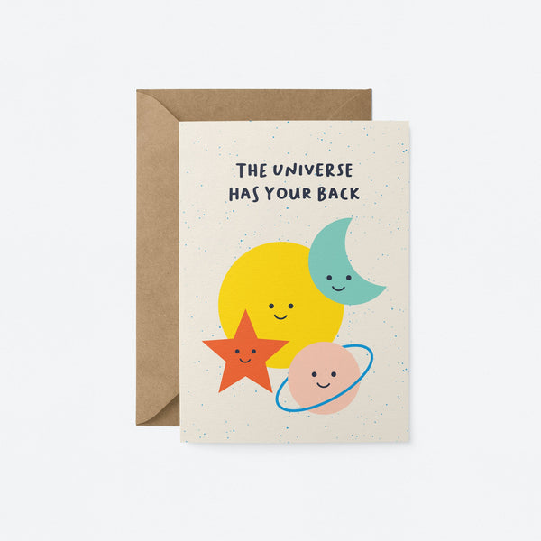 Everyday greeting card with a yellow sun, blue crescent moon, red star and pink planet and a text that says the universe has your back