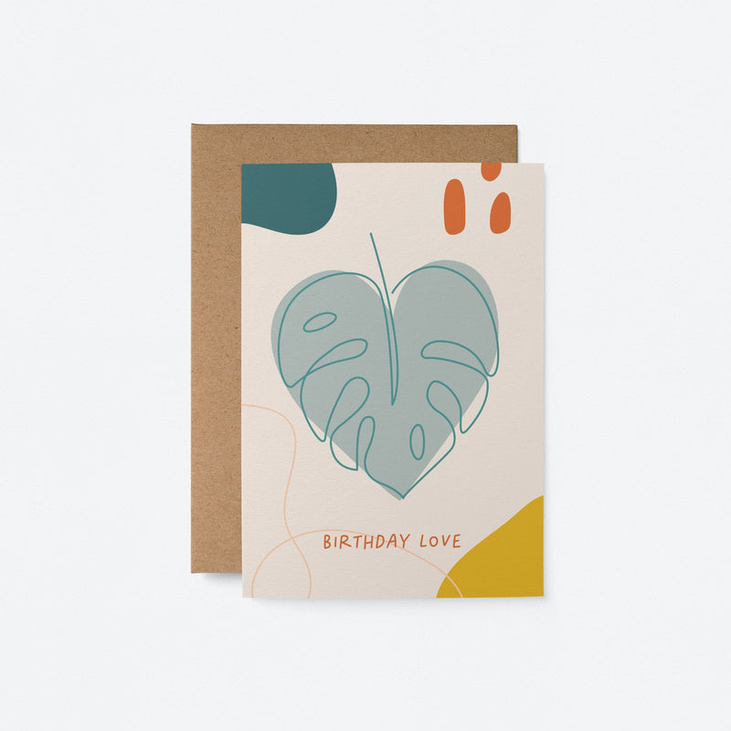 Birthday card with a heart shaped green leaf and a text that says birthday love