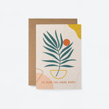 birthday card with a green plant drawing and a orange sun figure and a text that says so glad You were born