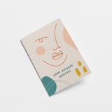 birthday card with a woman face drawing with lines and a green leaf and a text that says happy birthday beautiful