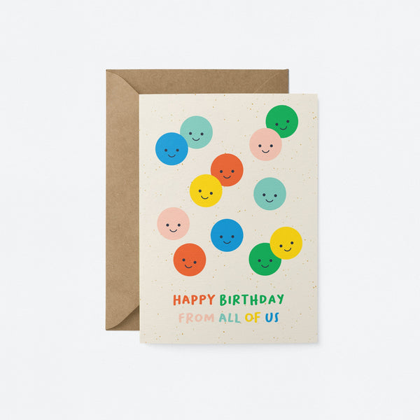 birthday card with colorful balloons with smiley faces and a text that says happy birthday from all of us