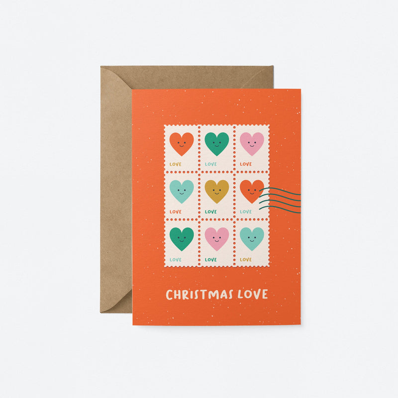 christmas greeting card with colorful heart shaped letter stamps and a text that says christmas love