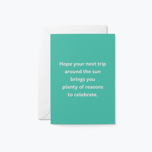 birthday card with a text that says hope your next trip around the sun brings you plenty of reasons to celebrate