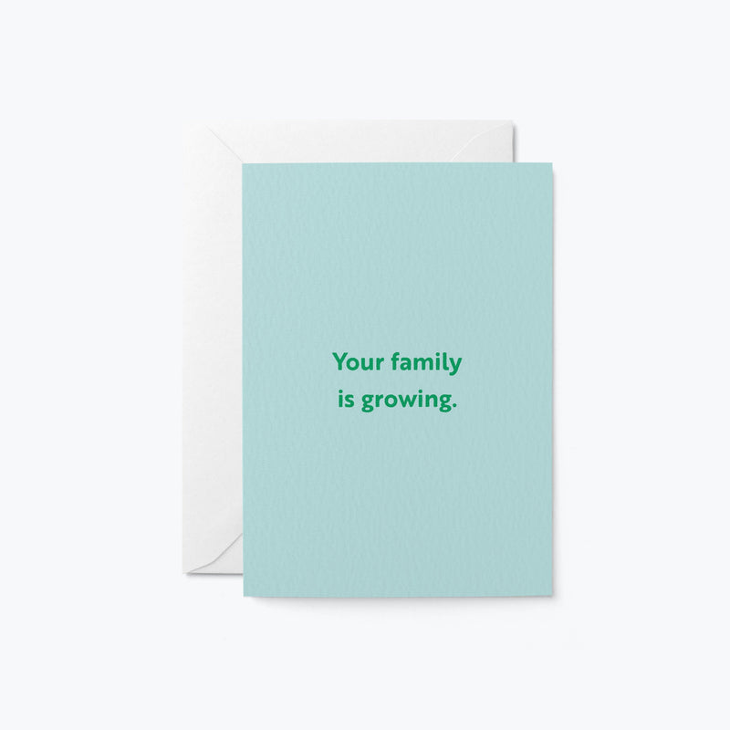 new baby card with a text that says your family is growing