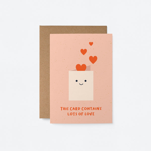 friendship card with a white envelope and red heart shapes and a text that says this card contains lots of love
