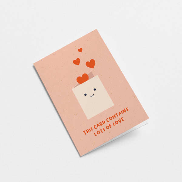 friendship card with a white envelope and red heart shapes and a text that says this card contains lots of love