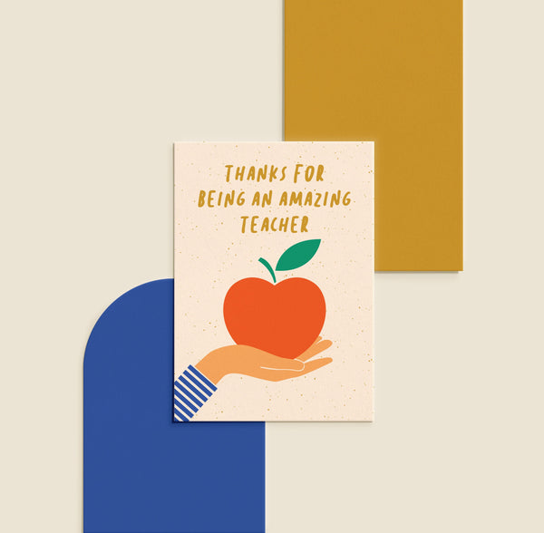 teachers card with a hand holding an apple and a text that says Thanks for being an amazing teacher