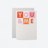 Typographic Love greeting card says You and me with warm colours on white background. Matched soft Grey envelope.