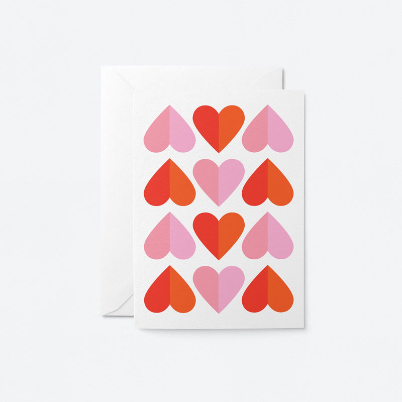 a greeting card features pink and red hearts pattern
