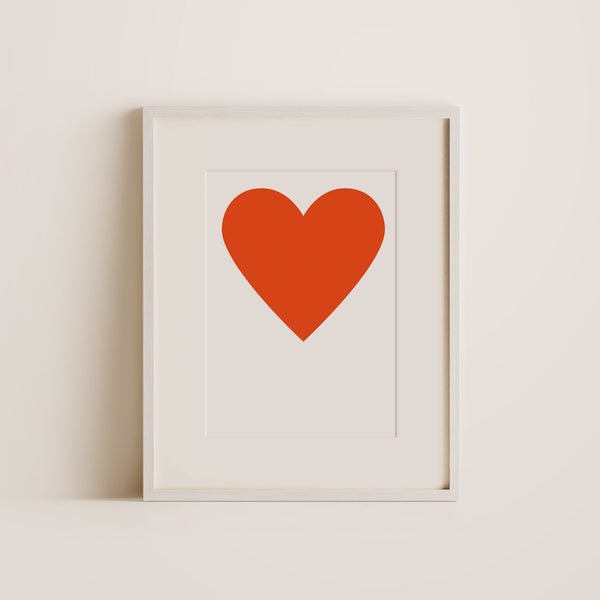 a big red heart print with white frame.